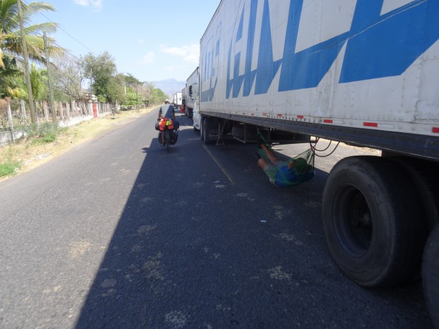 The drivers sleep as they can in the huge line of trucks before the border 